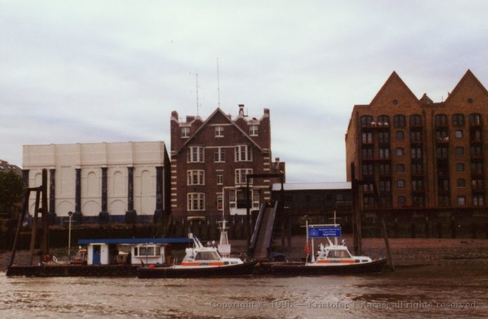 Floating police barracks on the Thames, England.