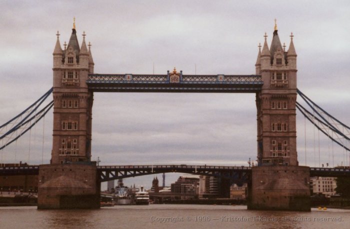 Close-up of Tower&nbsp;Bridge as riverboat readies to pass beneath; London
