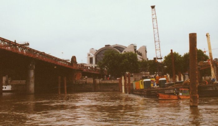 Charing Cross and bridge as seen from a riverboat on the Thames, London