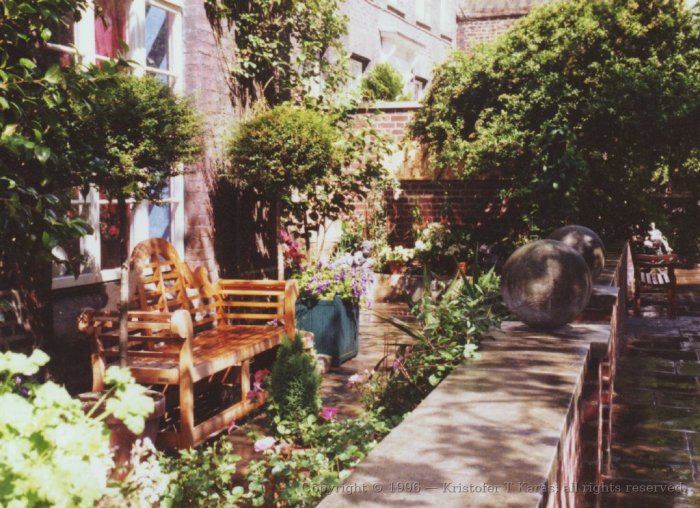 Flowers and sitting bench, churchyard garden, Westminster Abbey, London