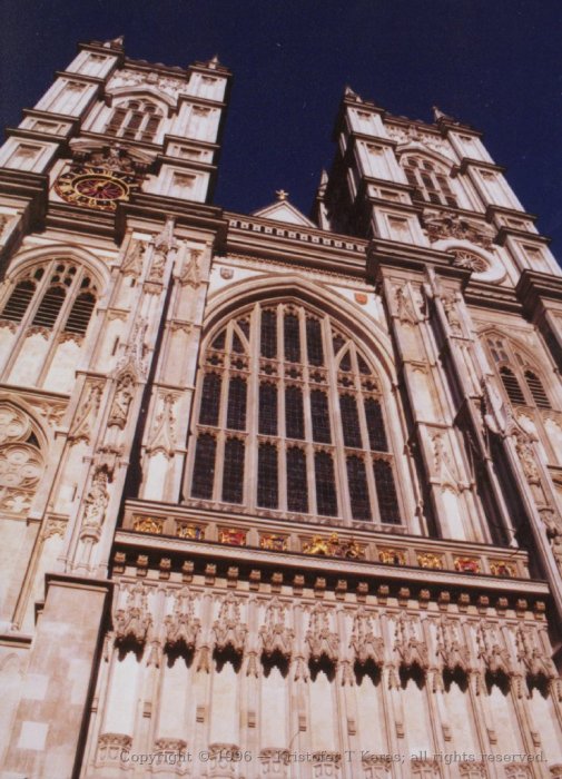 Centered, skyward looking view of front of Westminster Abbey, London