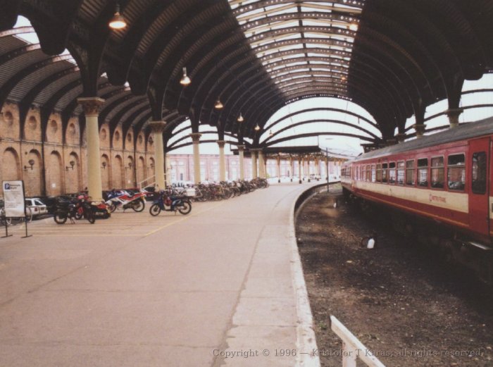 Motorbike park on a platform interior to York Railway Station, England
