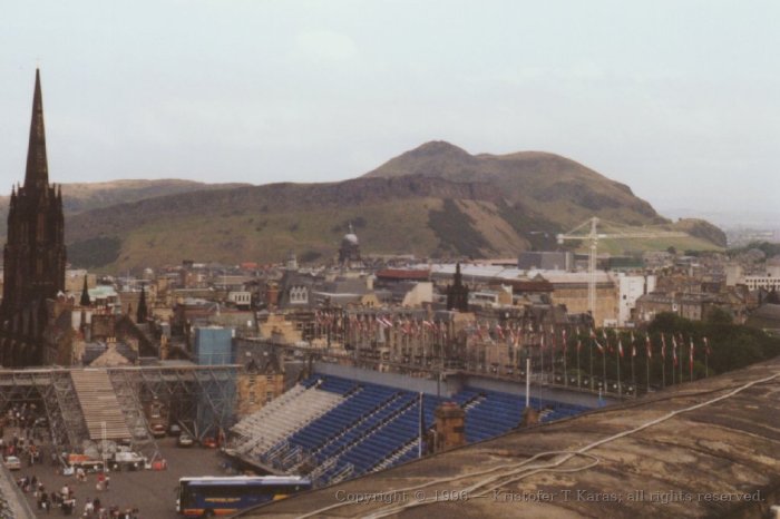 Nearby hills act as backdrop to the entrance to Edinburgh Castle, Scotland