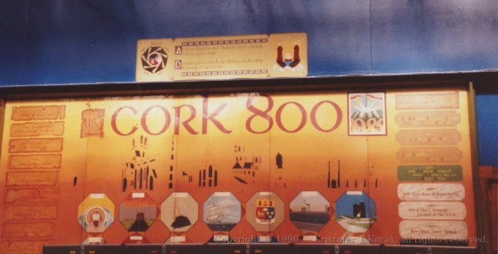 Plaque celebrating 800 years of Cork, obscured, in railway station; Ireland