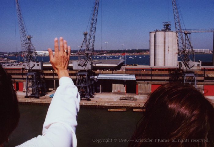 Passengers wave good-bye to friends and family on QE2's pier; Southampton