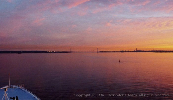 The bow of the QE2 heads quietly towards New York City's outer harbor