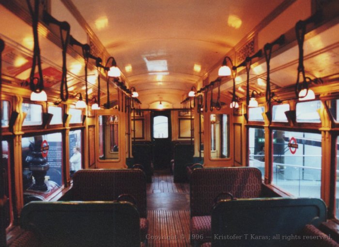 Warmly-lit tube carriage interior, London Transport Museum