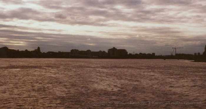 Moody sky above the Thames, River-cruise upstream, Greenwich, England