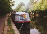 Houseboat on Grand Union Canal with "Garfield" cover, London