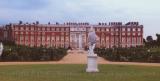 Rear section of Hampton Court with statue, England