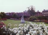 Flowers and a statue in the garden at Hampton Court, England