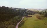 Hilly downs seen from Heart of Wales line