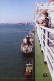 Fuel barge and tug alongside the QE2